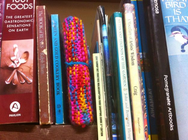 yarn bomb bookshelf